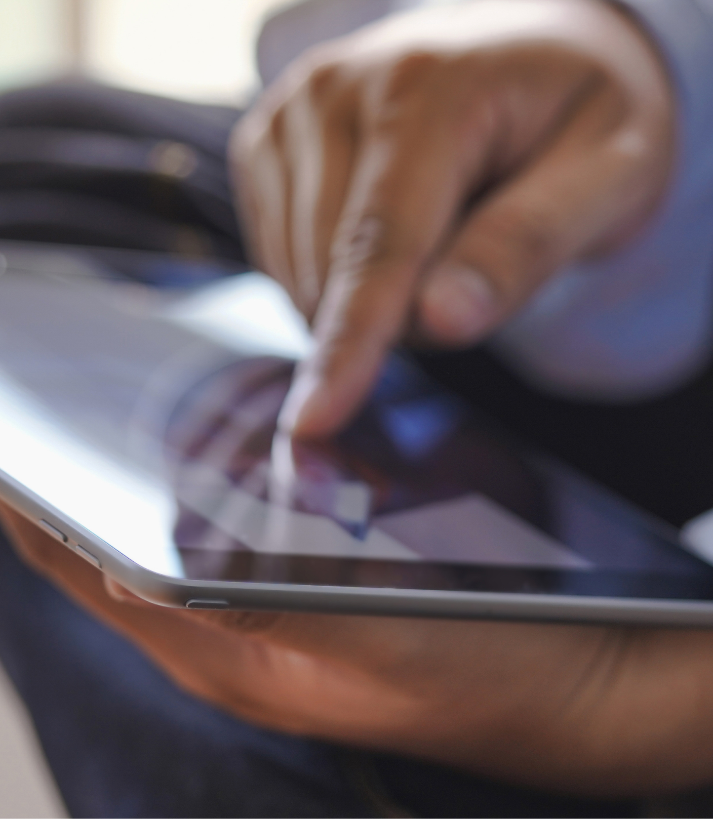 A member reviewing an application on a tablet
